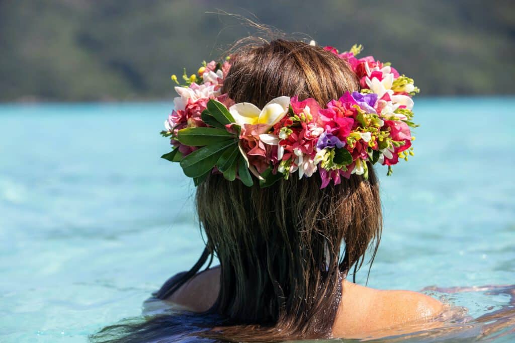 Woman wearing colorful floral crown in Bora Bora